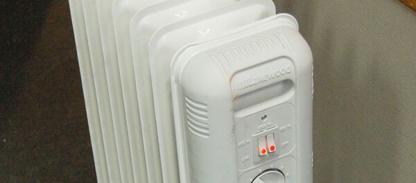 Масляный обогреватель, архивное фото - Sputnik Тоҷикистон