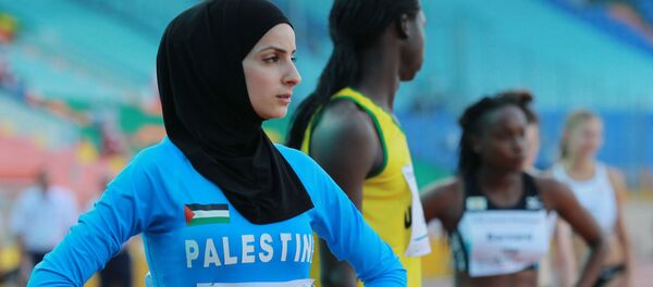 Палестинка Воруд Савалха во время соревнований среди женщин по легкой атлетике на Универсиаде в Казани Палестинка Воруд Савалха во время соревнований среди женщин по легкой атлетике на Универсиаде в Казани - Sputnik Таджикистан