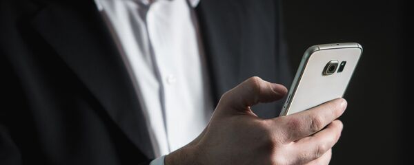 Сотовый телефон, архивное фото - Sputnik Тоҷикистон