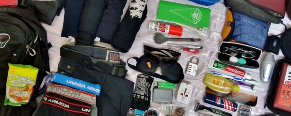 Сбор вещей перед путешествием, архивное фото Сбор вещей перед путешествием, архивное фото - Sputnik Таджикистан