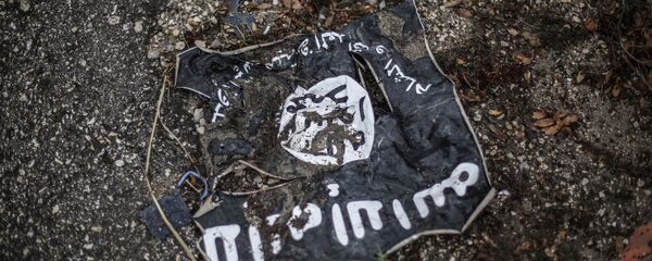 Флаг радикальной исламистской организации ИГИЛ - Sputnik Тоҷикистон