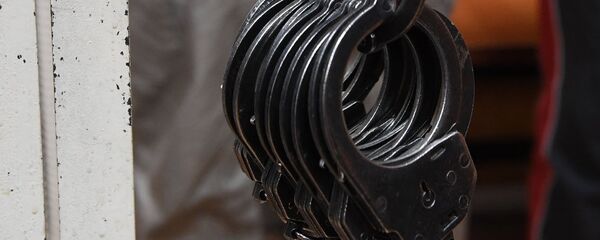 Наручники, архивное фото Наручники, архивное фото - Sputnik Тоҷикистон