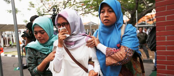 Родственники пассажиров самолета Lion Air JT610, потерпевшего крушение в индонезии - Sputnik Тоҷикистон