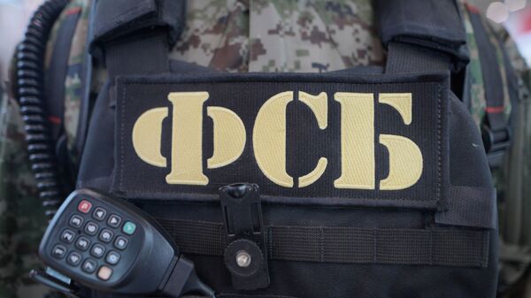 Бронежилет и рация сотрудника ФСБ РФ, архивное фото - Sputnik Таджикистан