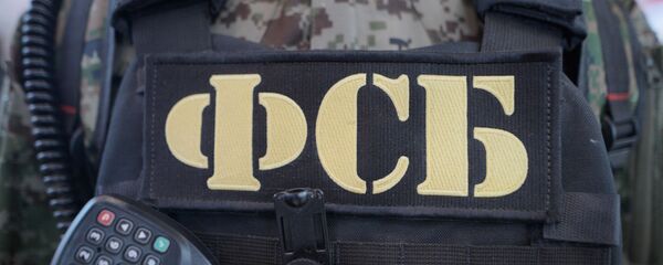 Бронежилет и рация сотрудника ФСБ РФ, архивное фото - Sputnik Тоҷикистон