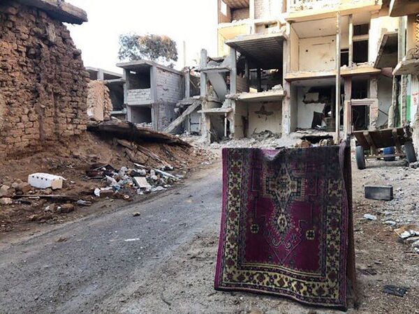 Разрушенные в результате боевых действий дома в жилой части города Пальмиры, архивное фото - Sputnik Таджикистан
