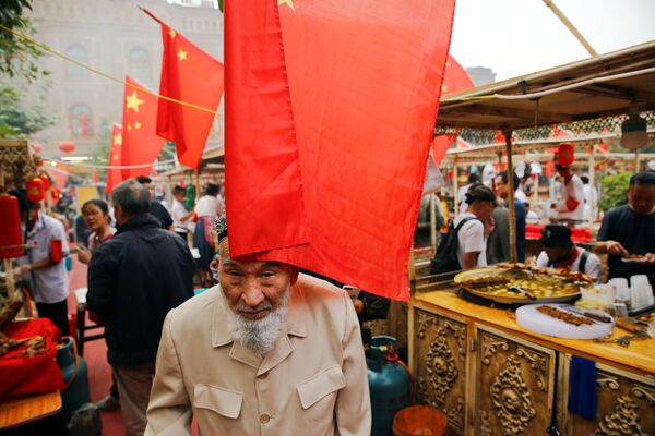 Уйгуры — тюркоязычный народ, подавляющее большинство их живет в регионе под названием Синьцзян на крайнем западе Китая. - Sputnik Таджикистан
