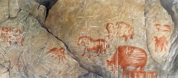 Наскальные рисунки первобытного человека эпохи палеолита, архивное фото - Sputnik Таджикистан