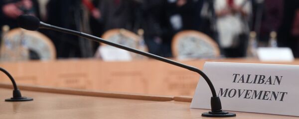 Табличка на столе представителей движения Талибан, архивное фото Табличка на столе представителей движения Талибан, архивное фото - Sputnik Тоҷикистон