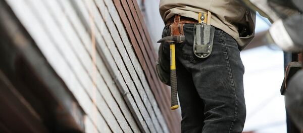 Строитель, архивное фото - Sputnik Тоҷикистон