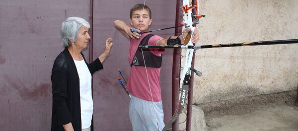 Зебинисо Рустамова со своим учеником Зебинисо Рустамова со своим учеником - Sputnik Тоҷикистон