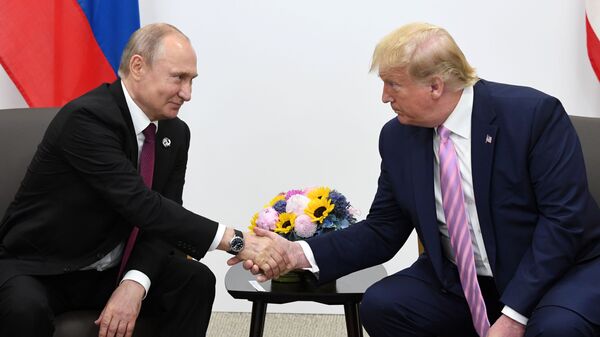 Президент РФ Владимир Путин и президент США Дональд Трамп во время встречи на полях саммита Группы двадцати в Осаке. Архивное фото - Sputnik Тоҷикистон