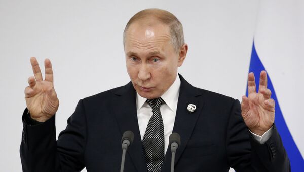  Президент РФ В. Путин на пресс-конференции на саммите G20 в Осаке - Sputnik Таджикистан