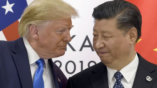 Президент США Дональд Трамп и председатель КНР Си Цзиньпин в ходе встречи на саммите G20 в Осаке. 29 июня 2019 - Sputnik Таджикистан