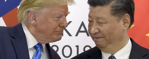 Президент США Дональд Трамп и председатель КНР Си Цзиньпин в ходе встречи на саммите G20 в Осаке. 29 июня 2019 - Sputnik Таджикистан