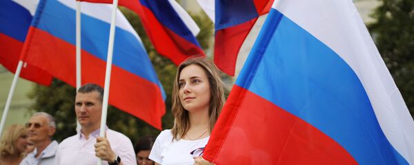 Празднование Дня государственного флага России Празднование Дня государственного флага России - Sputnik Таджикистан