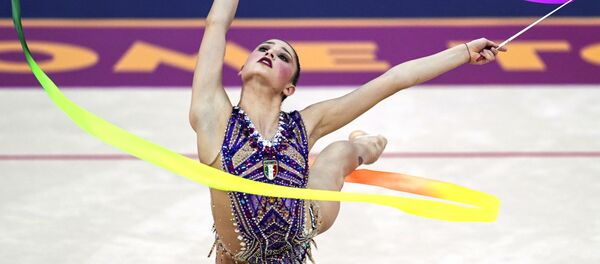 Выступление гимнастки Милены Бальдассари на чемпионате мира по художественной гимнастике в Баку Выступление гимнастки Милены Бальдассари на чемпионате мира по художественной гимнастике в Баку - Sputnik Таджикистан