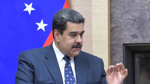 Президент Венесуэлы Николас Мадуро во время встречи с президентом РФ Владимиром Путиным - Sputnik Тоҷикистон