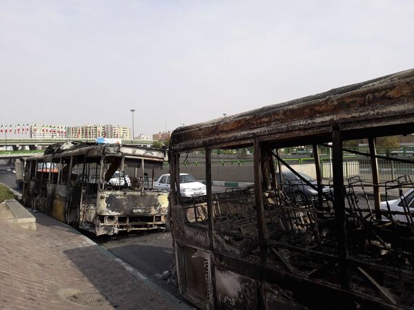 Сожженные автобусы в Тегеране  - Sputnik Тоҷикистон