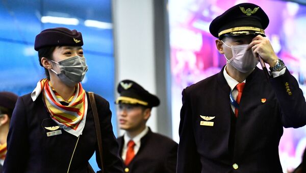 Экипаж воздушного судна в медицинских масках - Sputnik Таджикистан