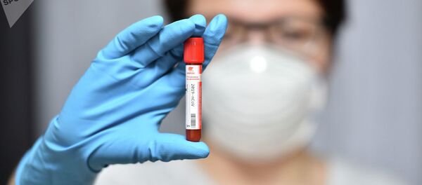 Пробирка с коронавирусом 2019-nCoV  - Sputnik Тоҷикистон