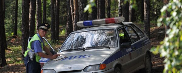 Сотрудник российской полиции, архивное фото Сотрудник российской полиции, архивное фото - Sputnik Таджикистан